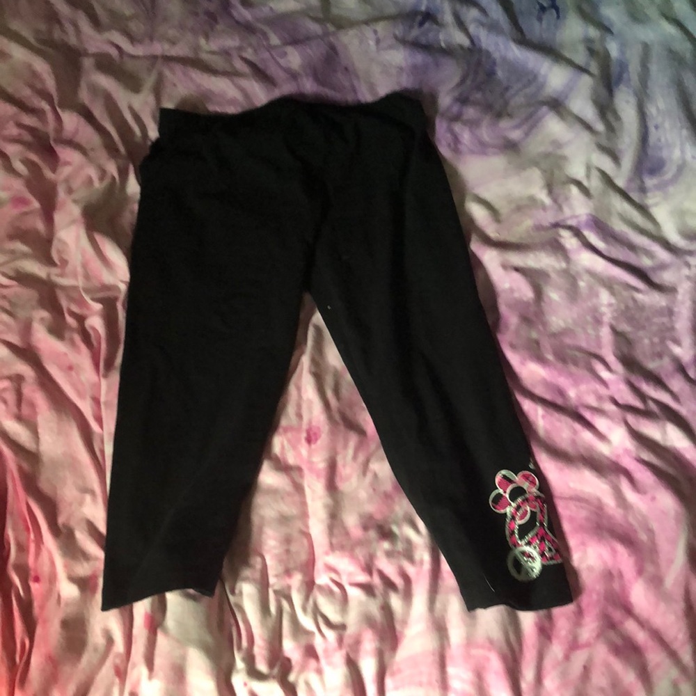 Black leggings with pink peace sign
